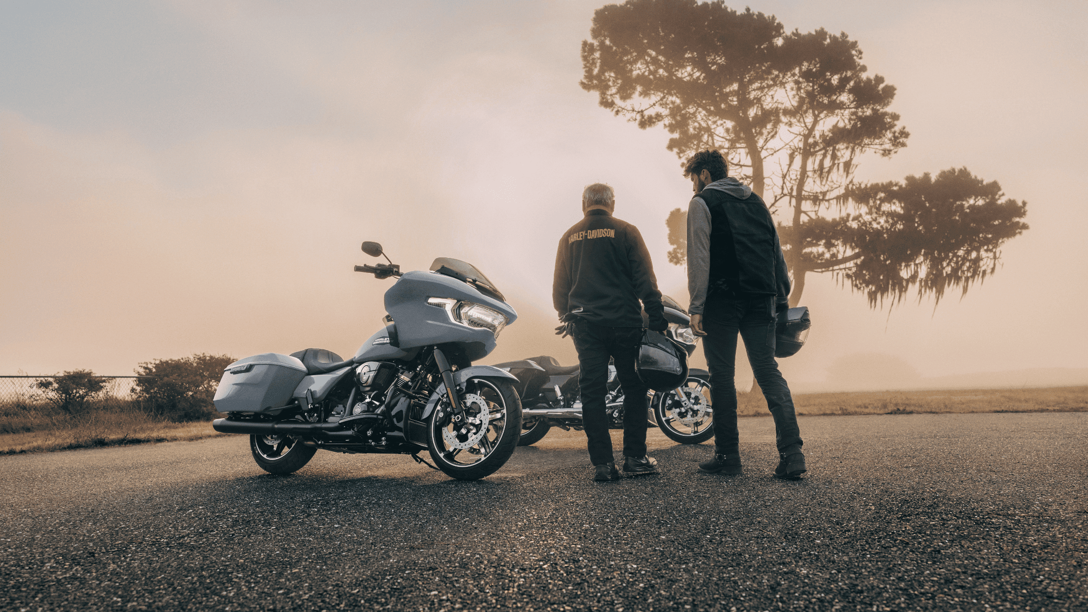 Two riders beside 2025 Road Glide near Covington, GA during foggy sunrise ride