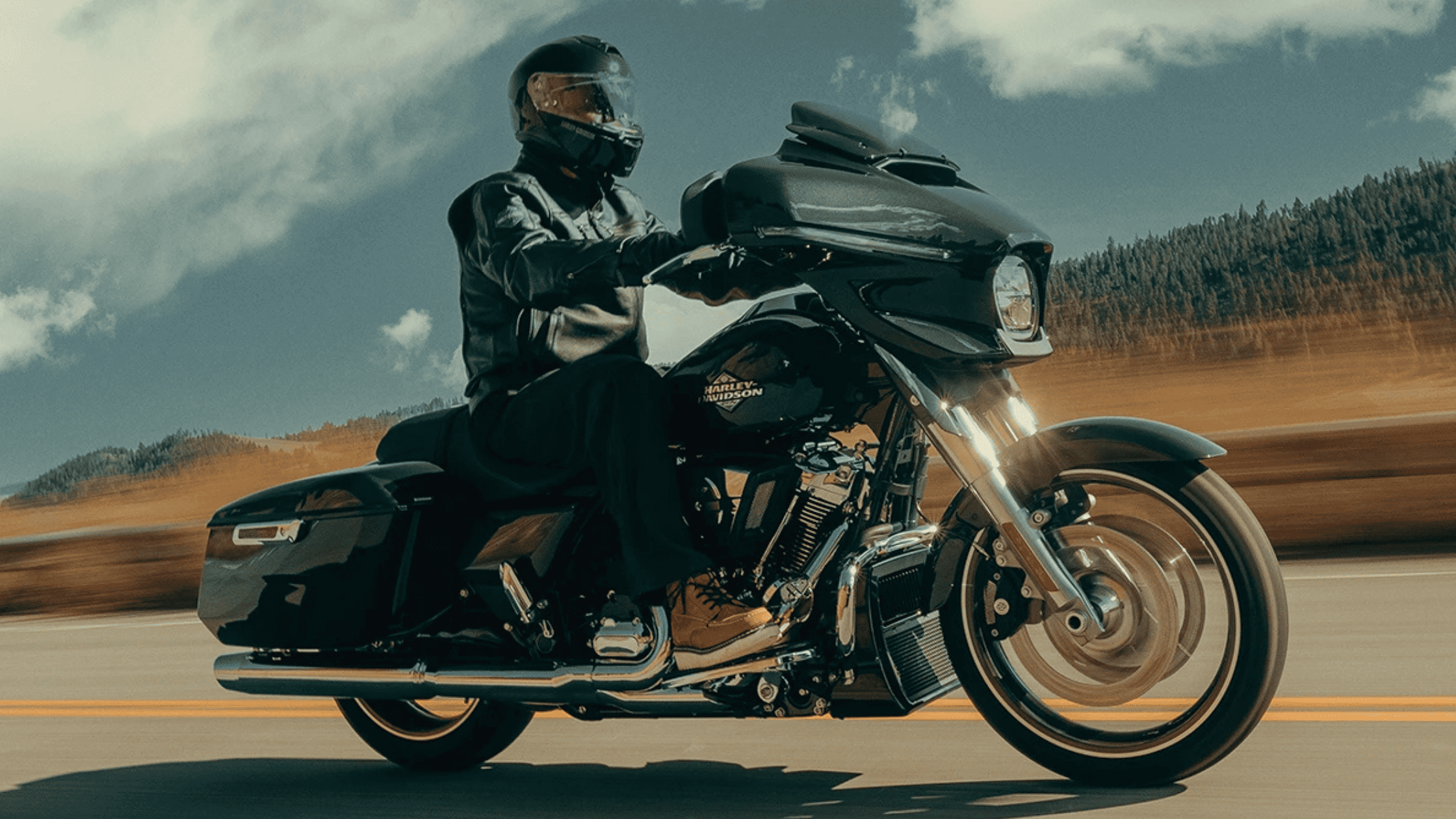 2025 Street Glide cruising on road near Covington, GA with helmeted rider